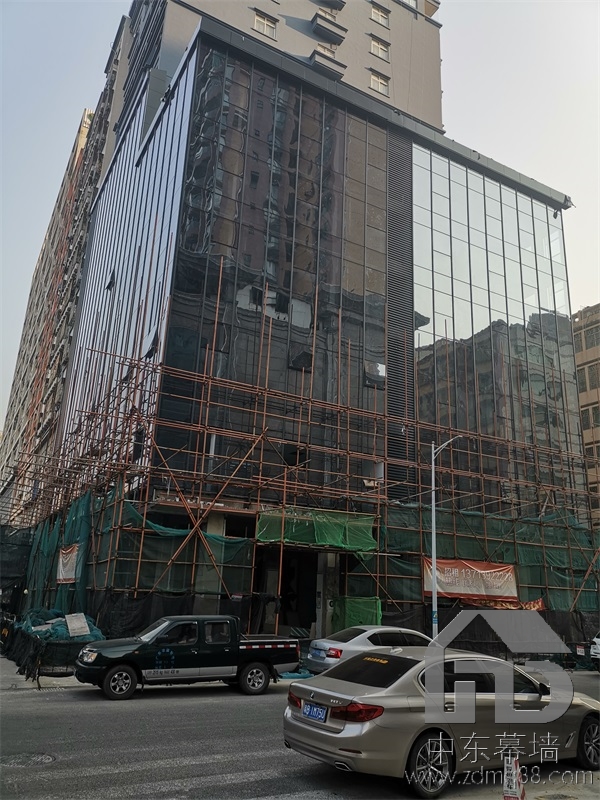 為什么現(xiàn)代建筑用玻璃幕墻？